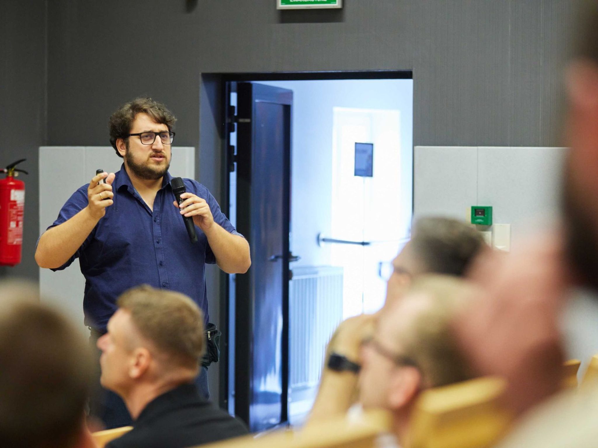 Michał Strześniewski speaking to the audience at the event